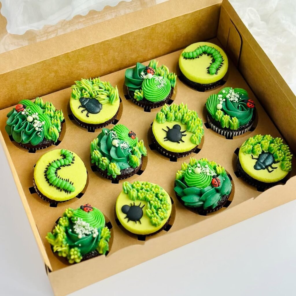 9 Best Halloween Party Treats Sure To Spook Your Guests 9 Chocolate cupcakes with chocolate frosting and gummy worms on top, displayed on an orange cake stand.