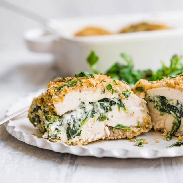 Stuffed chicken breasts with spinach and mushrooms served with green beans and roasted potatoes.