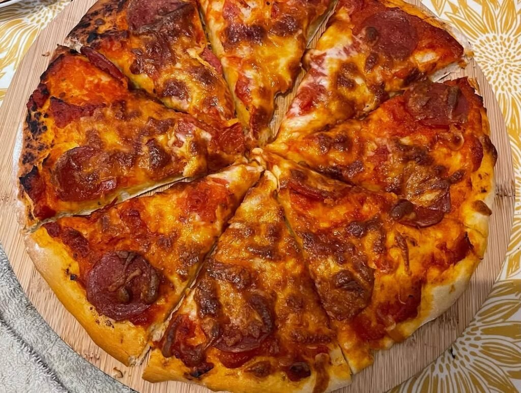 13 Easy And Delicious Grandma Pizza Recipes You Need To Try 12 A delicious pizza topped with caramelized onions and goat cheese, garnished with fresh herbs.