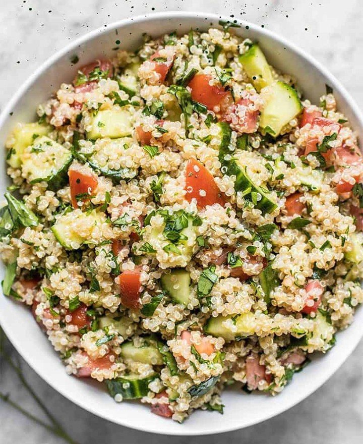 6 Homemade Dog Food Recipes To Soothe Itchy Skin 7 A bowl of quinoa and vegetable mix for dogs, featuring colorful veggies.