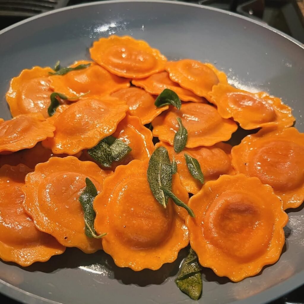 10 Delicious Vegetarian Pasta Recipes to Savor 8 Butternut squash ravioli served in sage butter with fresh sage leaves