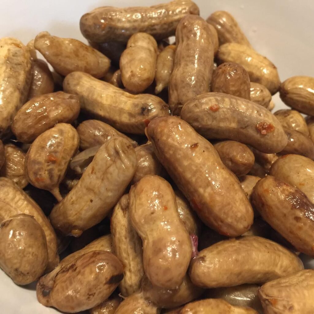 A bowl of boiled peanuts on a porch