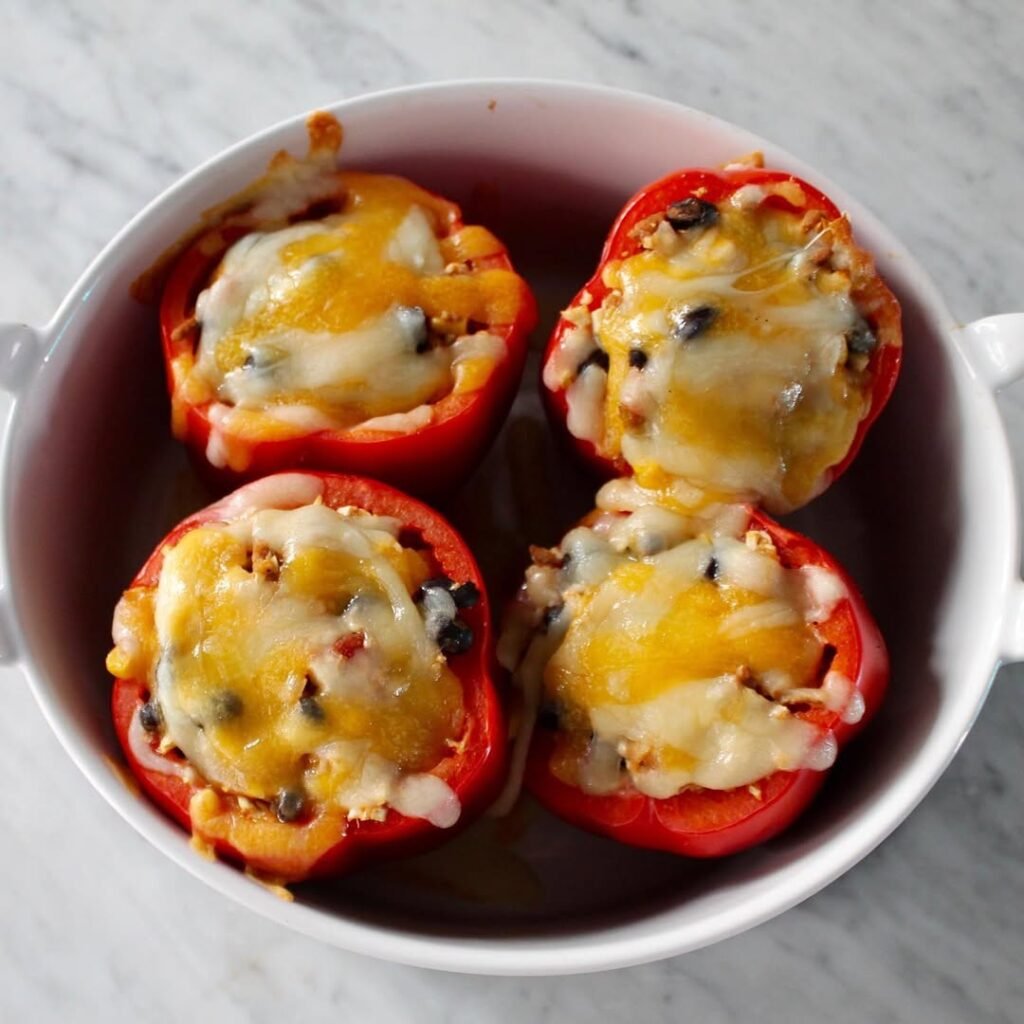 Stuffed bell peppers filled with quinoa and black beans on a plate