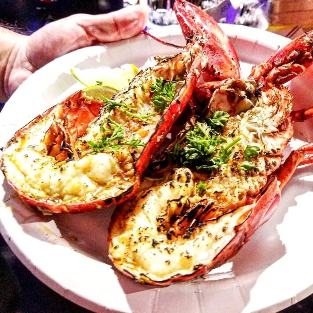 10 Lobster Dinner Recipes For A Taste Of Luxury 6 Grilled lobster tails with garlic butter and lemon on a wooden table