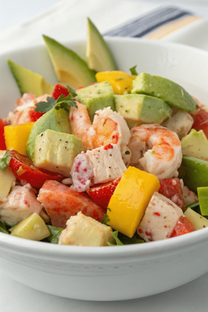 10 Lobster Dinner Recipes For A Taste Of Luxury 2 A vibrant lobster salad with avocado, bell peppers, and a citrus vinaigrette.
