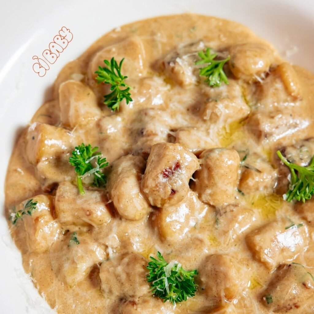 10 Irresistible Gnocchi Dinner Recipes You Must Try 4 A plate of mushroom and truffle oil gnocchi garnished with parsley.