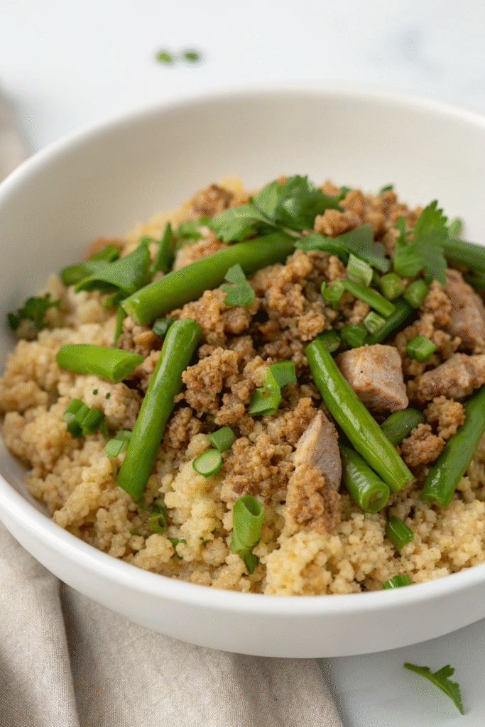 A bowl of turkey and quinoa medley with green beans